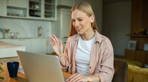 A woman in front of her laptop taking part in a video call.